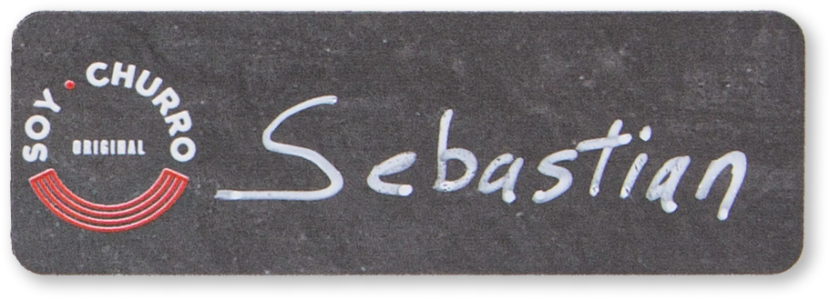 Chalkboard thin rectangle custom name tag with the name Sebastian on it