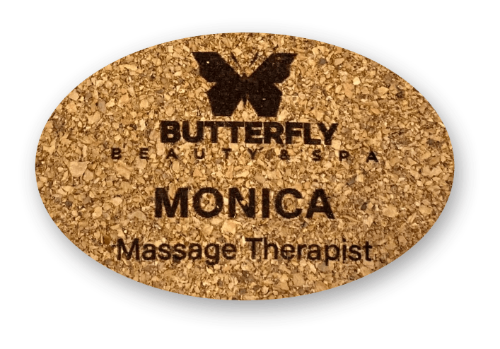 Thin oval cork name tag with the name Monica