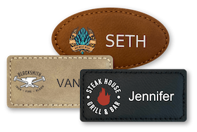 Three leather name tags in oval and rectangle shapes with names and logos